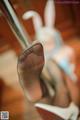 A close up of a woman's feet in high heels.